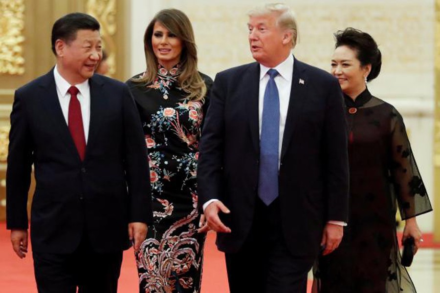 US President Donald Trump and first lady Melania arrive for the state dinner with China's President Xi Jinping and China's first lady Peng Liyuan at the Great Hall of the People in Beijing, China, recently. 	— Reuters