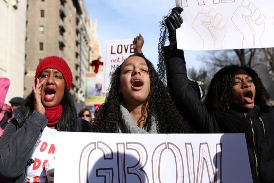 Women cheer at the Women's March in Manhattan in New York City, New York, US, Jan 20, 2018. Reuters