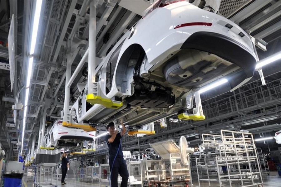 Workers work at a car general assembly line in Cangzhou, north China's Hebei Province, September 12, 2017. Xinhua/File Photo