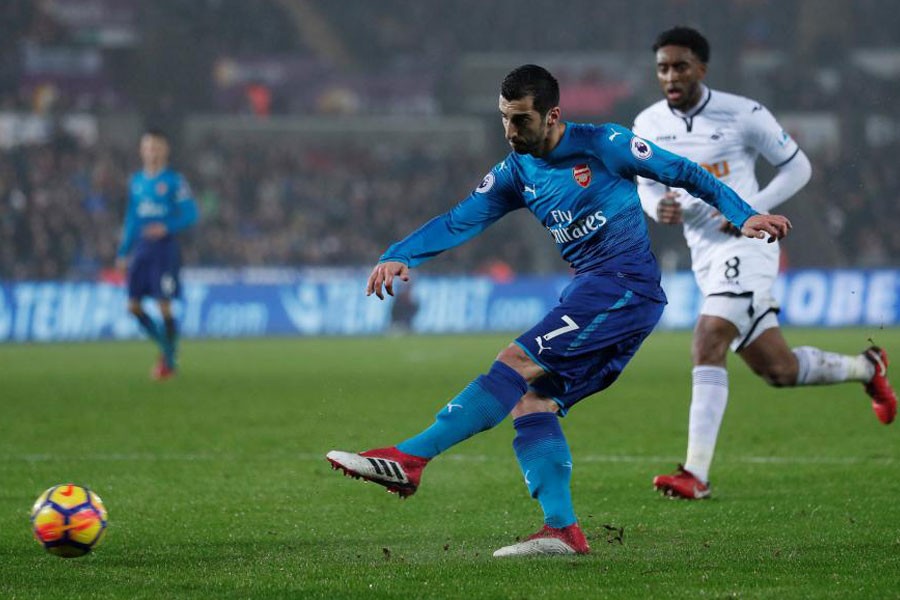 Premier League - Swansea City vs Arsenal - Liberty Stadium, Swansea, Britain - January 30, 2018. Arsenal's Henrikh Mkhitaryan shoots. (Reuters)