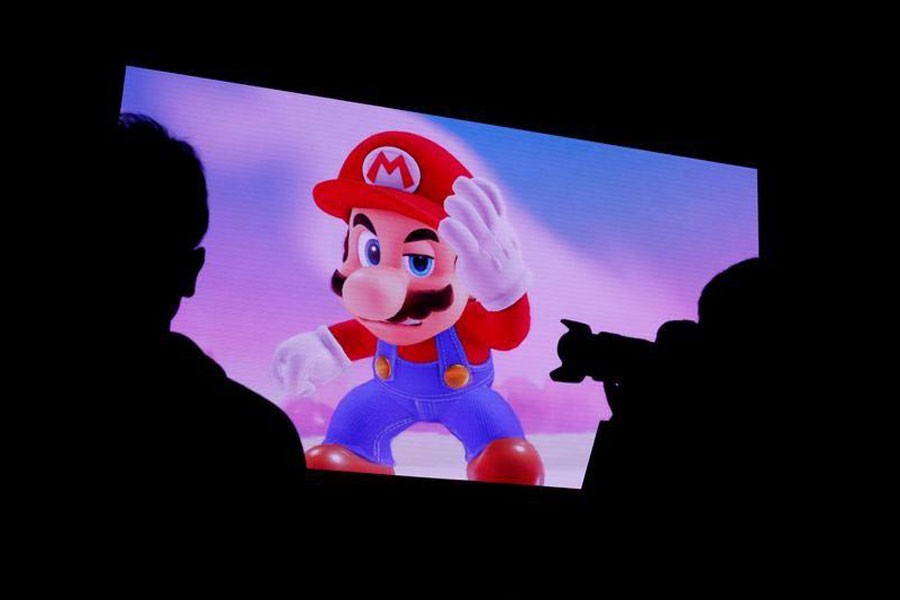 Nintendo's game character Super Mario is seen on a screen at the presentation ceremony of Nintendo's new game console Switch in Tokyo, Japan January 13, 2017. (REUTERS)