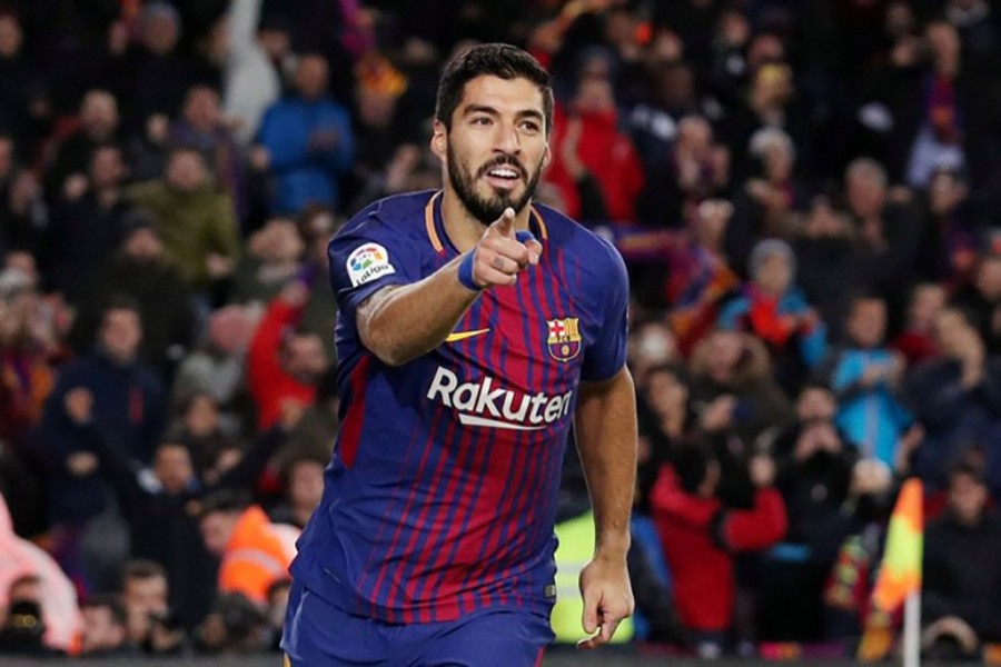 Luis Suarez celbrates his goal against Valencia. - Reuters photo