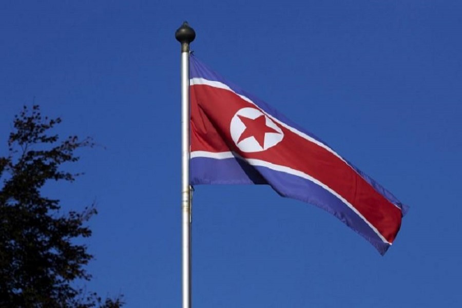 A North Korean flag flies on a mast at the Permanent Mission of North Korea in Geneva October 2, 2014. Reuters/Files