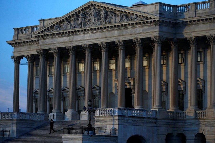 A security person walks down the stairs at the U.S. Capitol building in Washington, U.S., February 8, 2018. REUTERS/ Leah Millis