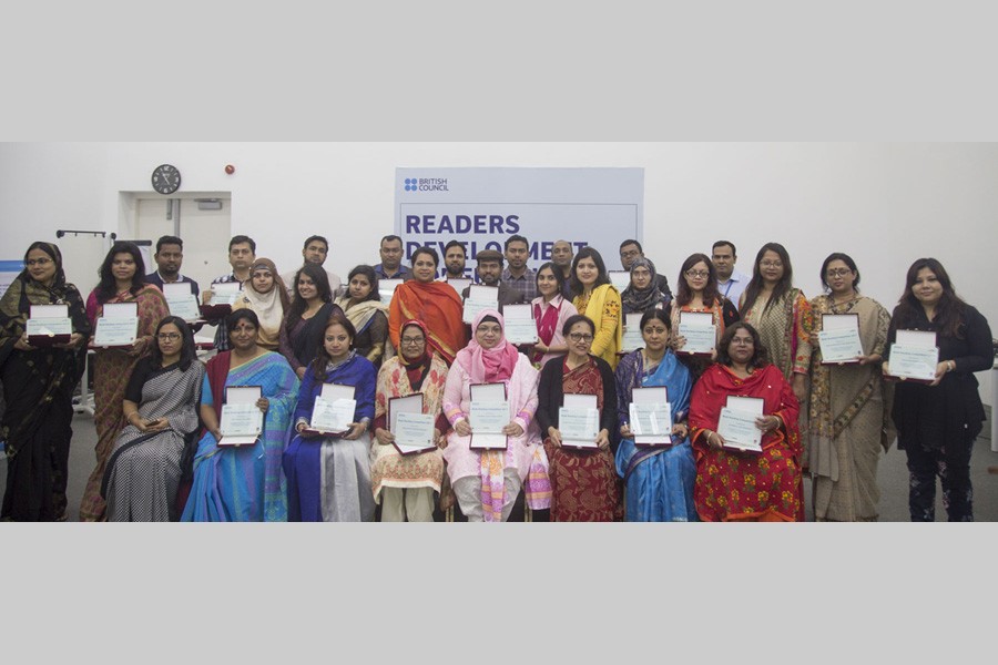 Participants pose with citations at a readers’ development conference, hosted by British Council, in the city recently.