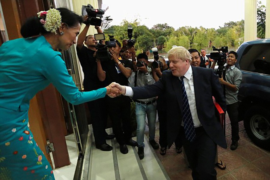 Boris Johnson was greeted by Myanmar leader Aung San Suu Kyi in Naypyidaw on Sunday. - Reuters photo.