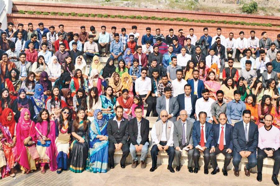 Teachers and students of East Delta University pose for a photograph with University Grants Commission (UGC) Chairman Prof Abdul Mannan after an orientation programme at their campus in Chittagong