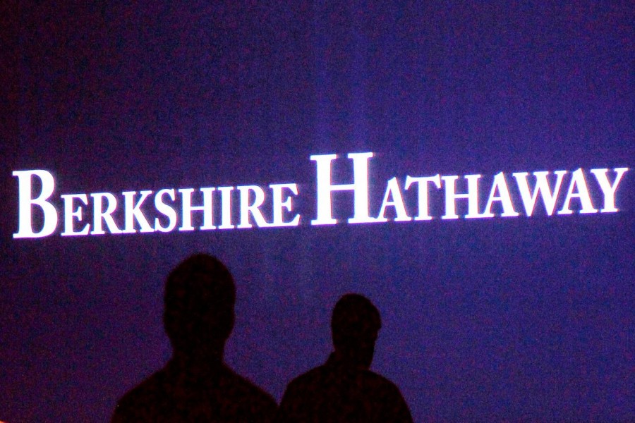 Berkshire Hathaway shareholders walk by a video screen at the company's annual meeting in Omaha, Nebraska, US, May 4, 2013. Reuters/File Photo