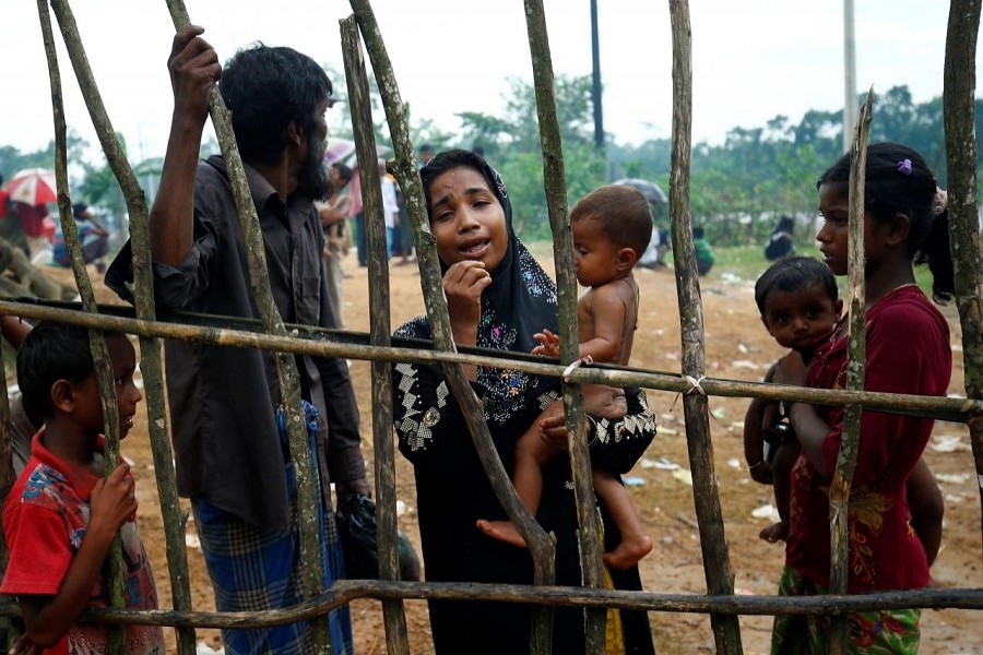 A new Rohingya refugee woman cries as they arrive near the Kutupalang makeshift Refugee Camp, in Cox's Bazar, Bangladesh, August 30, 2017. Reuters/Files