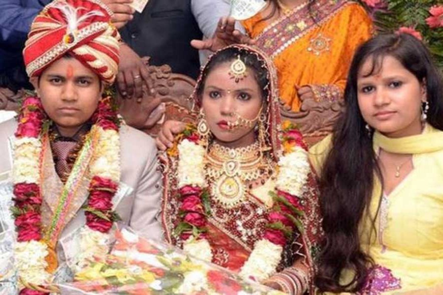 Krishna Sen (left) married her first wife (centre) in 2014. -BBC