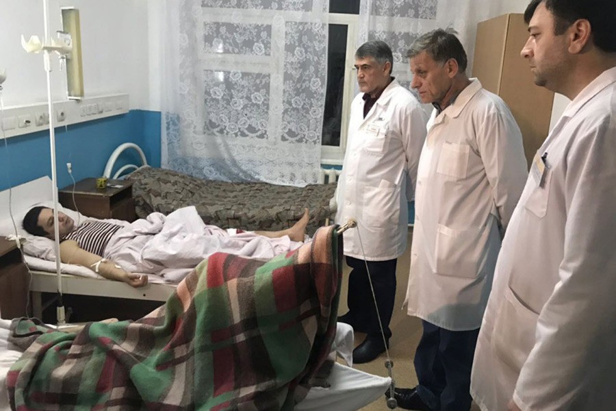 Doctors examine a wounded patient in the hospital after the church shooting. - Internet photo