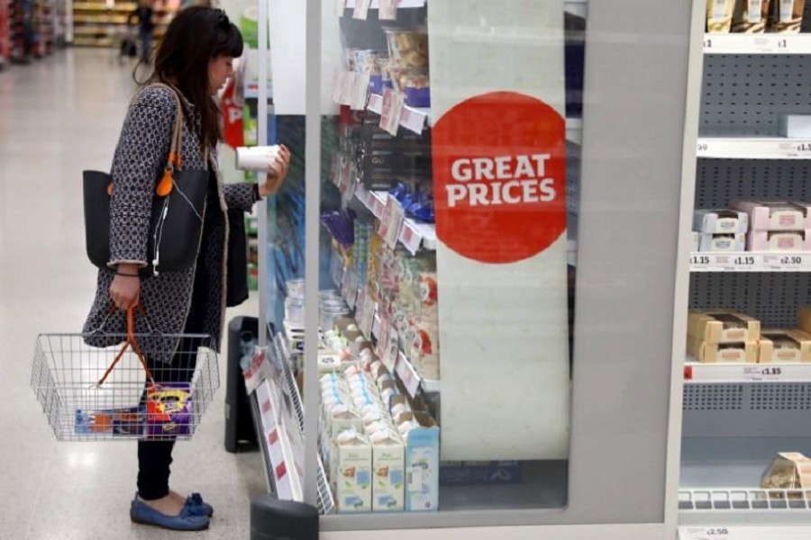 A woman shops in a supermarket in London, Britain April 11, 2017. Reuters/File Photo