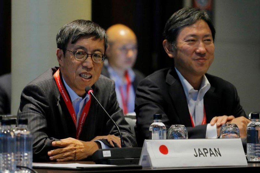 Japan's chief trade negotiator Kazuyoshi Umemoto (L) speaks at the Trans Pacific Partnership senior leaders meeting in Sydney, Australia August 28, 2017. Reuters/File Photo