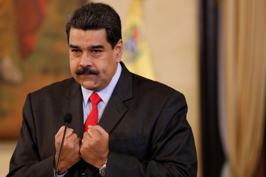 Venezuela's President Nicolas Maduro gestures as he talks to the media during a news conference in Caracas, February 15, 2018. - Reuters Photo