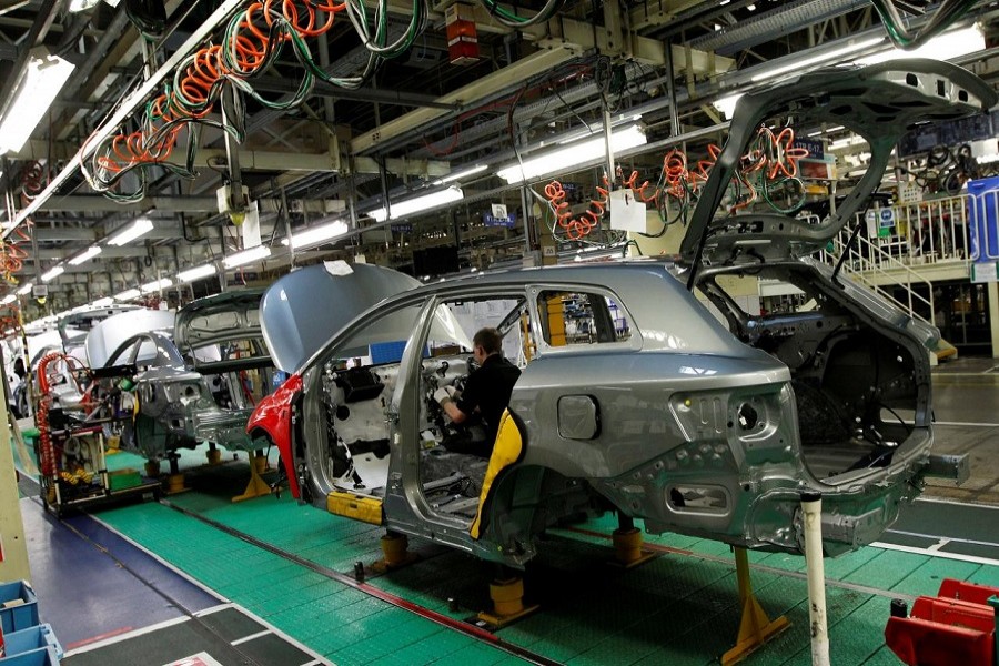 A man works on the production line at the Toyota factory in Derby, central England, March 7, 2011. Reuters/File Photo