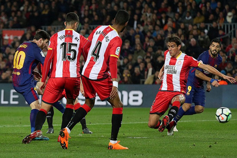 Messi pictured firing home Barcelona's second goal of the night after brilliant trickery inside the Girona area. - Reuters photo