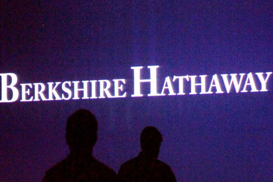 Berkshire Hathaway shareholders walk by a video screen at the company's annual meeting in Omaha, Nebraska, US, May 4, 2013. Reuters/File Photo