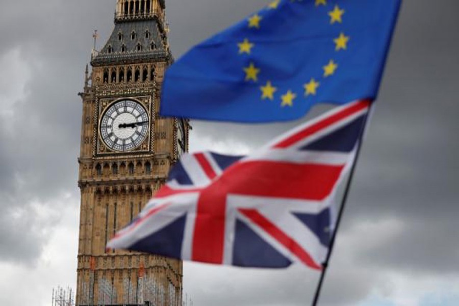 The Union Flag and a European Union flag fly near the Elizabeth Tower, housing the Big Ben bell in Parliament Square in central London, Britain. 	— Reuters