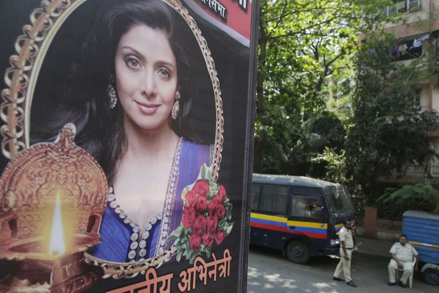 Indian policemen guard near a picture of Indian actress Sridevi displayed outside her residence in Mumbai, Feb. 27. Photo: AP