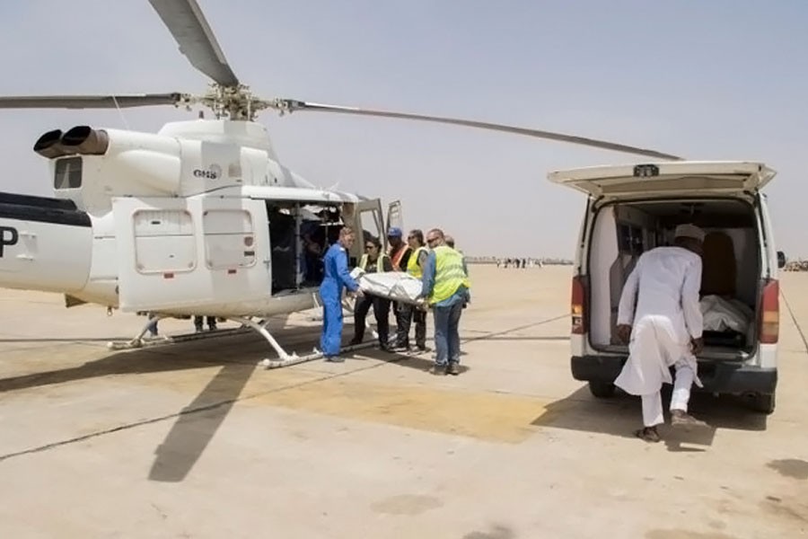 UNHAS members evacuate bodies of three aid workers, who were killed during an attack in the town of Rann, at Maiduguri Airport, Nigeria March 2, 2018. Reuters.