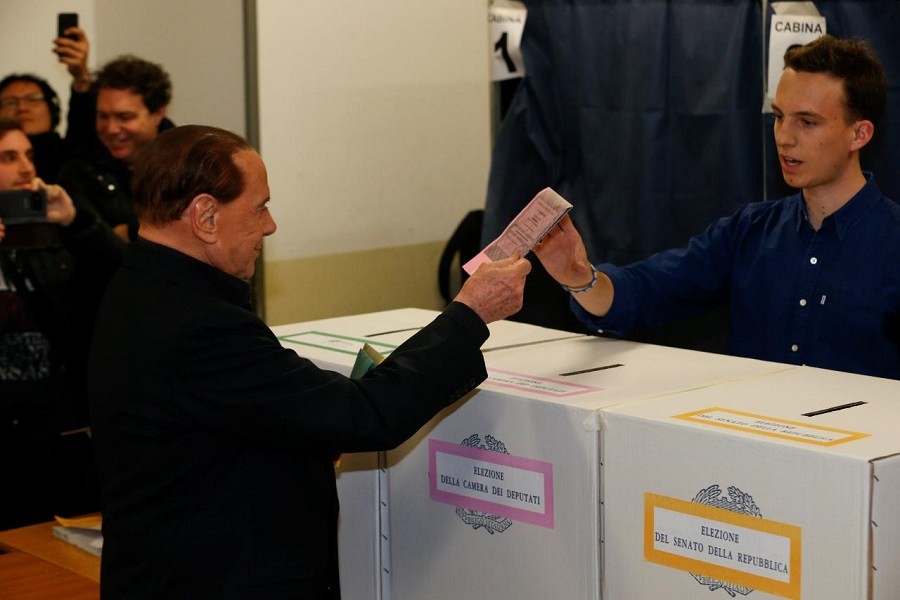 Forza Italia party leader Silvio Berlusconi casts his vote at a polling station in Milan, Italy March 4, 2018. Reuters