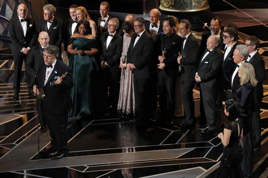 90th Academy Awards - Oscars Show - Hollywood, California, US, 04/03/2018 - Guillermo del Toro (L) accepts the Oscar for Best Picture for "The Shape of Water". Reuters