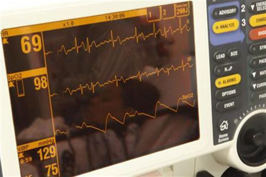 A patient is reflected in the heart monitor she is hooked up to in the emergency room at Ben Taub General Hospital in Texas.-Reuters Photo