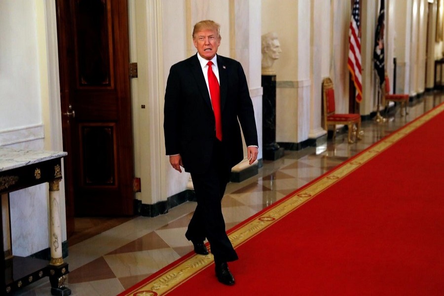 US President Donald Trump enters the East Room to speak at an opioid summit being held at the White House in Washington, US, March 1, 2018. Reuters