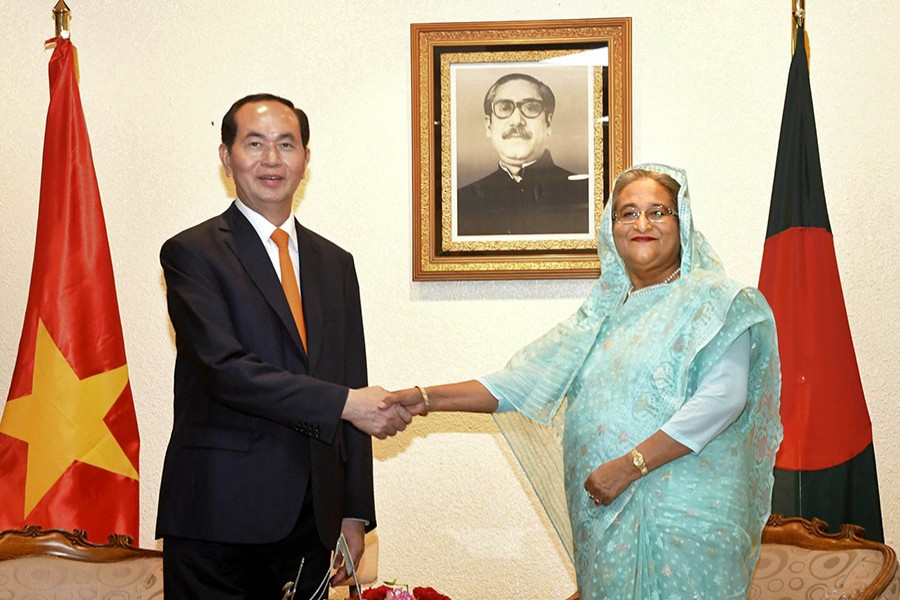 Prime Minister Sheikh Hasina shakes hands with Vietnamese President Tran Dai Quang at a bilateral meeting on Monday. - Focus Bangla photo