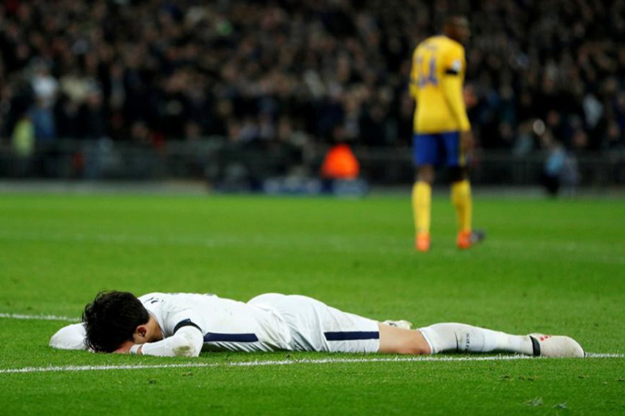 Tottenham's Son Heung-min lay out on the Wembley turf, looking emotionally and physically spent after the final whistle. - Reuters photo