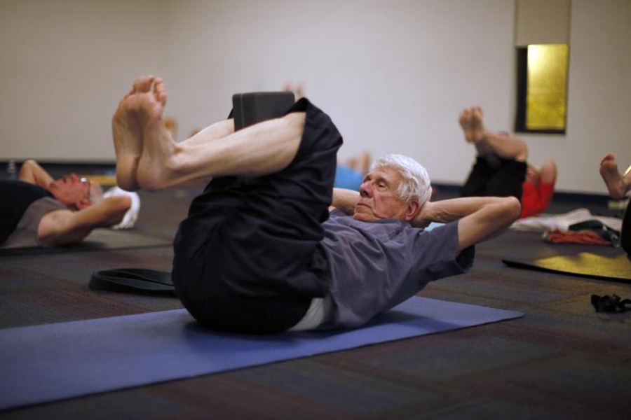 Retirees participate in a yoga class in Sun City, Arizona, January 7, 2013. Reuters/File Photo