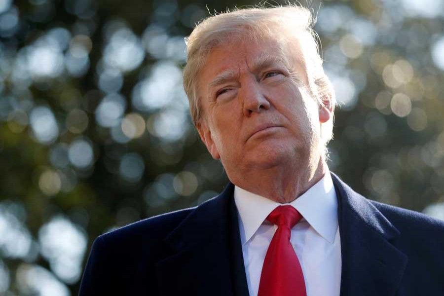 US President Donald Trump speaks with the media before boarding Marine One helicopter to depart for travel to California via Joint Base Andrews from the South Lawn of the White House in Washington, US, March 13, 2018. Reuters