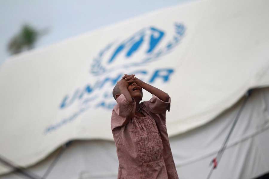 A girl from the Pauktaw township stands in front of her family's shelter in a Rohingya internally displaced persons (IDP) camp outside Sittwe May 15, 2013. Reuters/File Photo