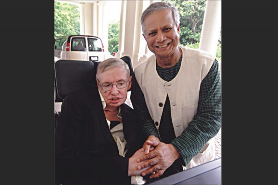 File photo shows Nobel Peace laureate Prof Muhammad Yunus shaking hands with world-renowned physicist Stephen Hawking at the Presidential Medal of Freedom Ceremony in Washington DC, US in 2009. Courtesy: Yunus Centre