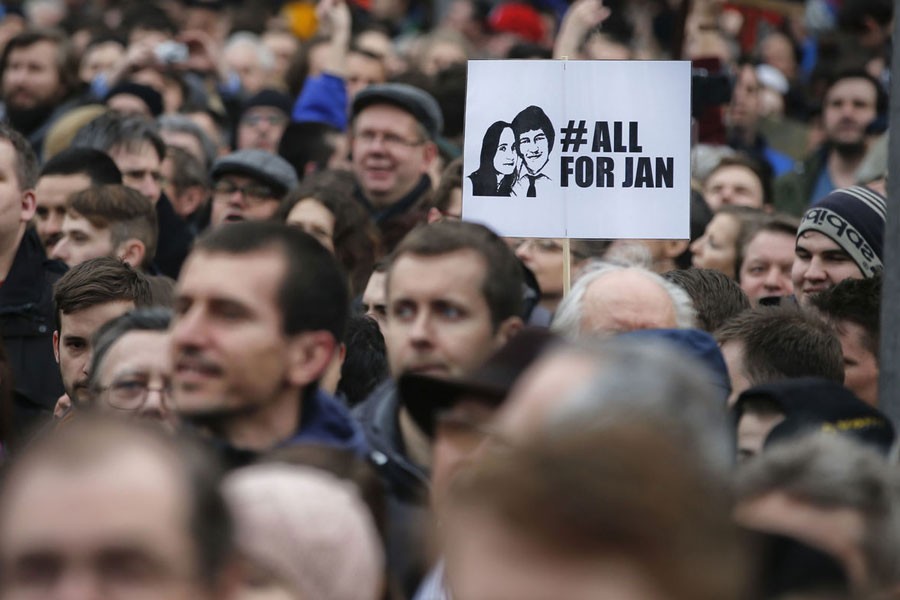 People celebrate the resignation of Prime Minister Robert Fico and his government as a way out of the political crisis triggered by the slayings of investigative journalist Jan Kuciak and his fiancee Martina Kusnirova, during a rally in Bratislava, Slovakia, Friday, March 16, 2018. AP Photo.