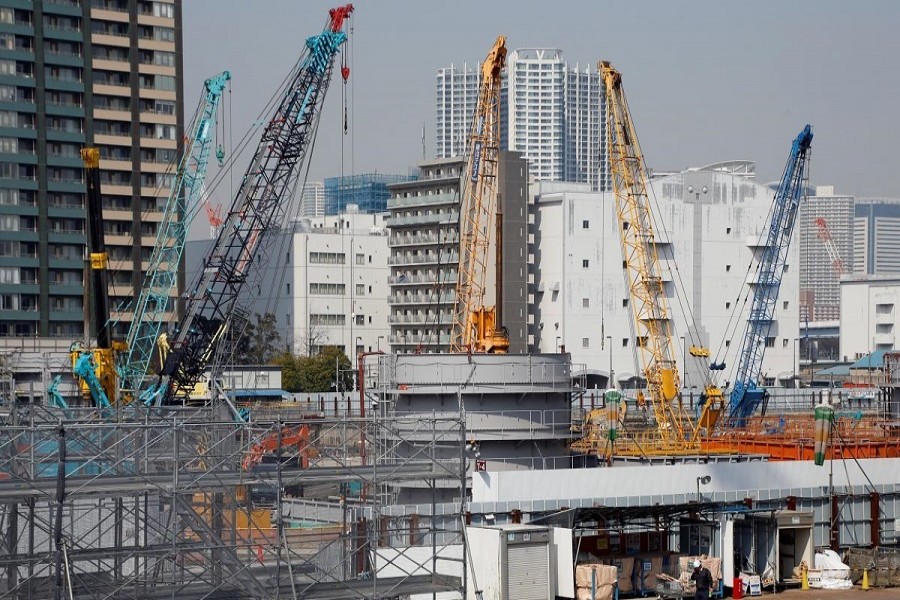 Cranes are seen at a construction site in Tokyo, Japan March 13, 2018. Reuters/Files