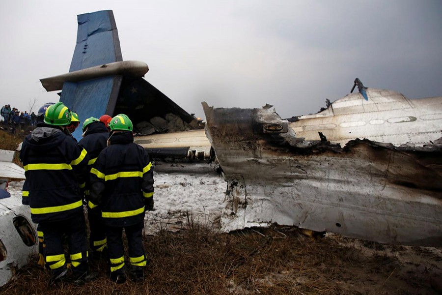 Rescue workers work at the wreckage of a US-Bangla airplane after it crashed at the Tribhuvan International Airport in Kathmandu, Nepal on Monday last - Reuters photo