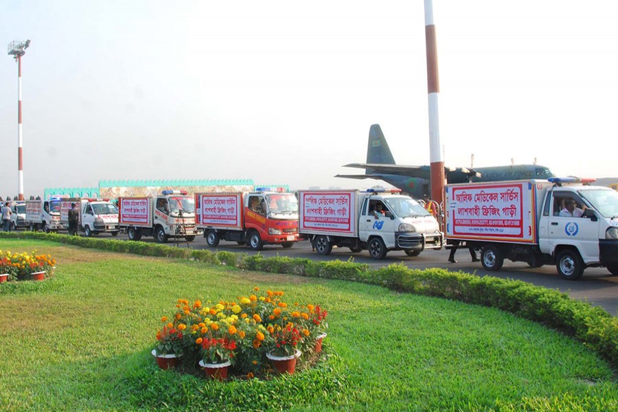 A fleet of ambulances, carrying the bodies of 23 plane crash victims, moves towards Army stadium on Monday - Focus Bangla photo