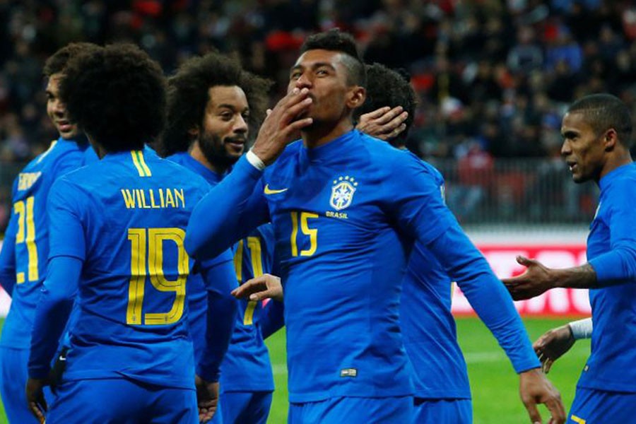 Brazil’s Paulinho celebrates scoring their third goal. Reuters photo.