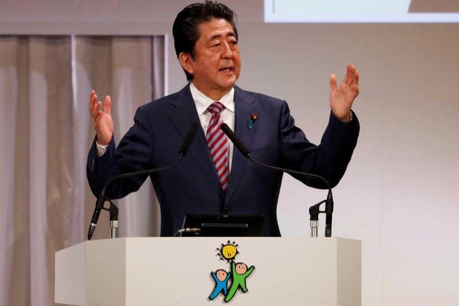 Japan's Prime Minister Shinzo Abe, who is also ruling Liberal Democratic Party (LDP) leader, bows as he delivers a speech during the LDP annual party convention in Tokyo, March 25, 2018. Reuters