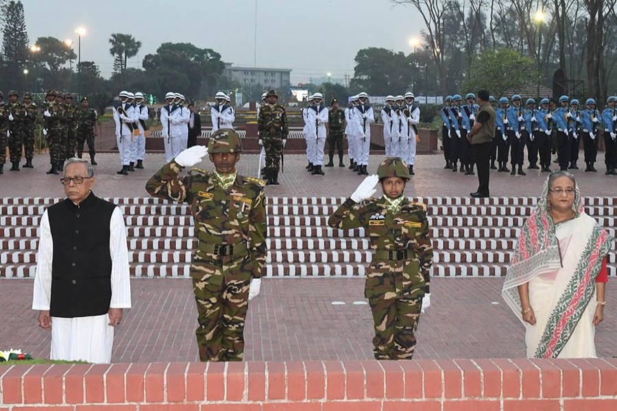 President Abdul Hamid (left) and Prime Minister Sheikh Hasina pay rich tributes to the martyrs of the Liberation War of Bangladesh by placing wreaths at the National Memorial in Savar marking the 48th Independence and National Day - Focus Bangla photo