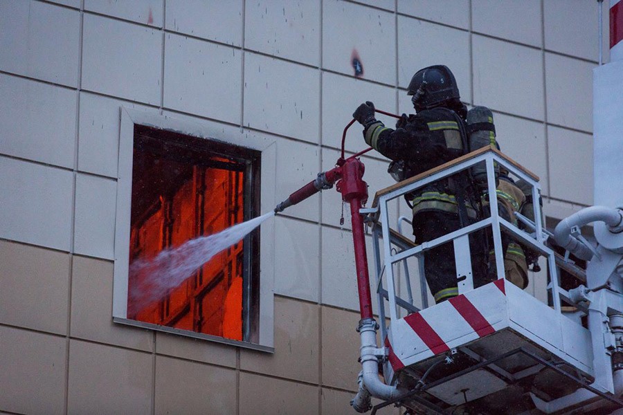 Members of the Emergency Situations Ministry work to extinguish a fire in a shopping mall in the Siberian city of Kemerovo, Russia March on Sunday - Reuters photo