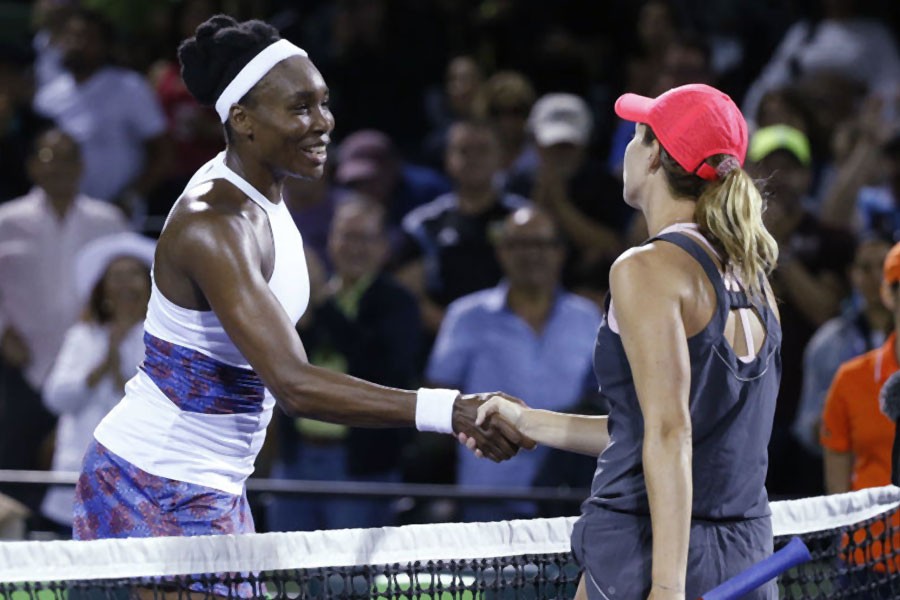 Venus Williams, left, and Danielle Collins, both of the United States, meet at the net after Collins’ 6-2, 6-3 win at the Miami Open tennis tournament Wednesday, March 28, 2018, in Key Biscayne, Fla. (AP Photo)