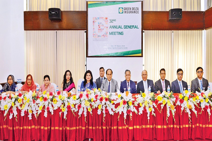 Green Delta Insurance Limited Chairman Md. Abdul Karim, Managing Director and CEO Farzana Chowdhury and sponsor-directors seen on the dais at the 32nd Annual General Meeting of the company held at Spectra Convention Center in the capital on Thursday