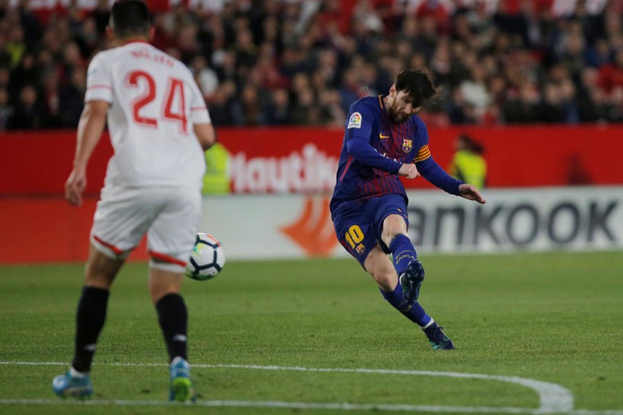 Barcelona's Lionel Messi scores their second goal against Sevilla - Reuters photo