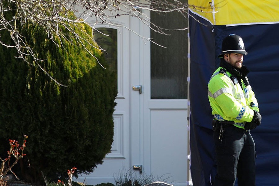 A police officer stands guard outside of the home of former Russian military intelligence officer Sergei Skripal, in Salisbury. Reuters.