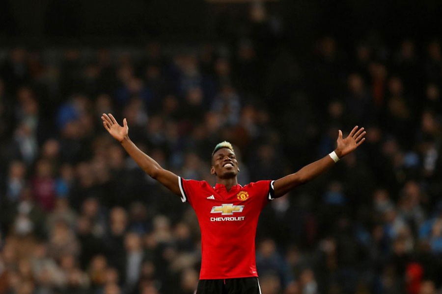 Premier League - Manchester City vs Manchester United - Etihad Stadium, Manchester, Britain - April 7, 2018 Manchester United’s Paul Pogba celebrates after the match. Reuters.