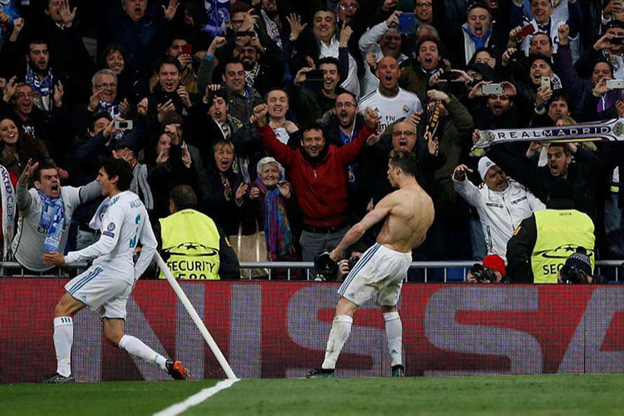 A wild Ronaldo celebrates in front of the jubilant Real Madrid supporters after scoring an added-time penalty which sends the Los Blancos into the semi-finals - Reuters photo