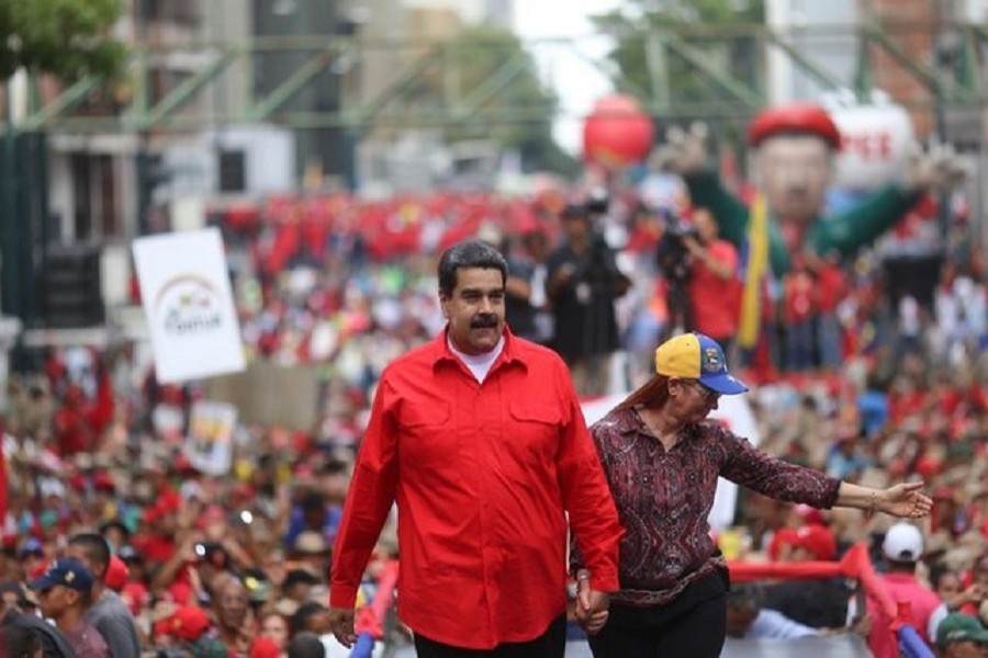 Venezuela's President Nicolas Maduro and his wife Cilia Flores attend a rally with supporters in Caracas, Venezuela April 14, 2018. Reuters