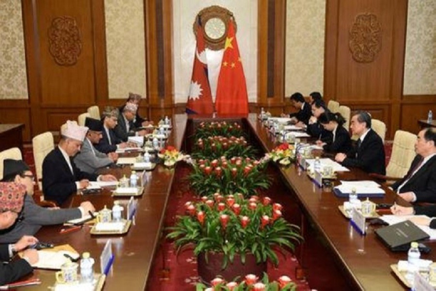 Chinese Foreign Minister Wang Yi (2nd R) talks to Nepal's Foreign Minister Pradeep Kumar Gyawali (4th L) at the Diaoyutai State Guesthouse in Beijing, China April 18, 2018. Reuters